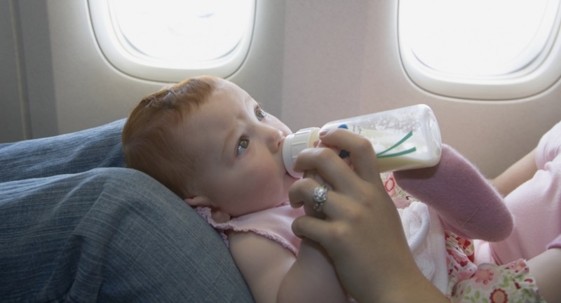 baby being fed on the plane